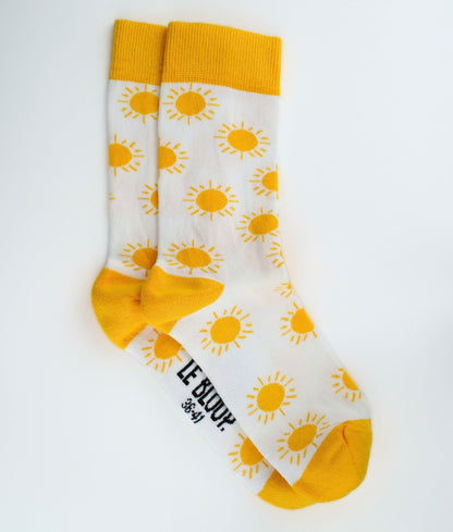 Chaussettes fantaisie en coton biologique jaunes avec motif de soleil