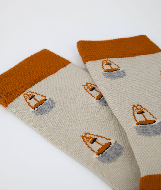 Chaussettes fantaisie en coton biologique orange avec motif de puits